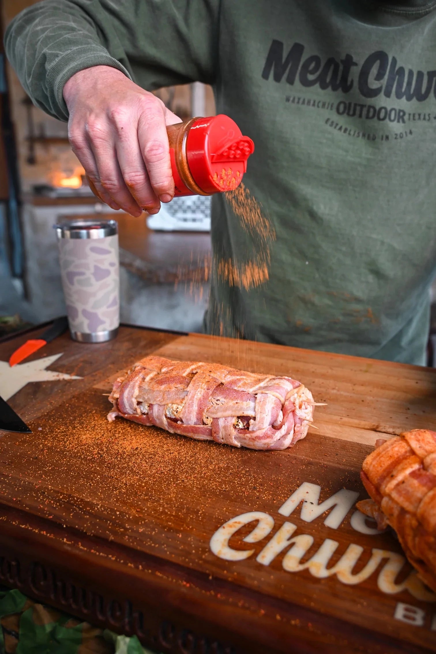 Barbecue rub being applied to meat